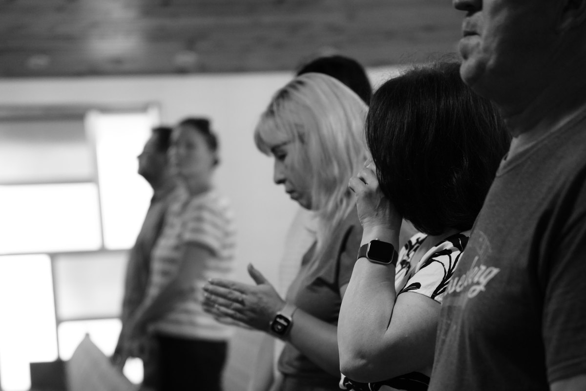 Church members praying together