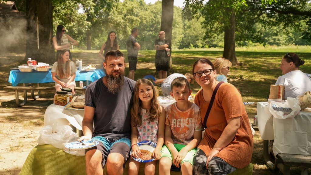 Families sharing a meal at the New Hope church picnic